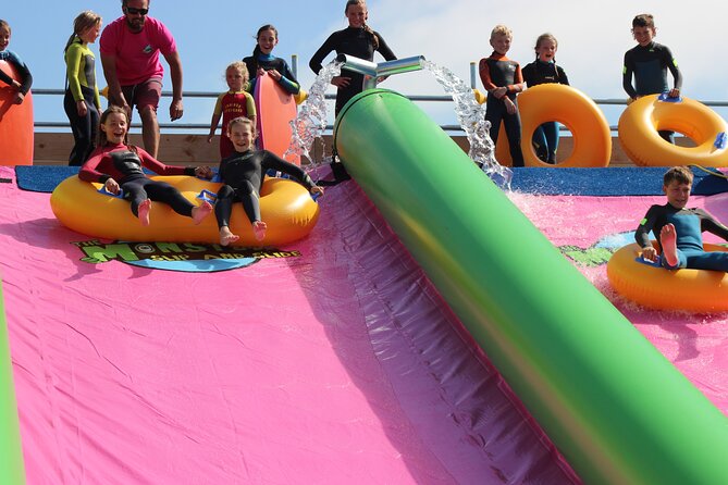 A monster 360ft long slip and slide session in BUDE, Cornwall - Wetsuits and grip socks: what to wear in Cornwall