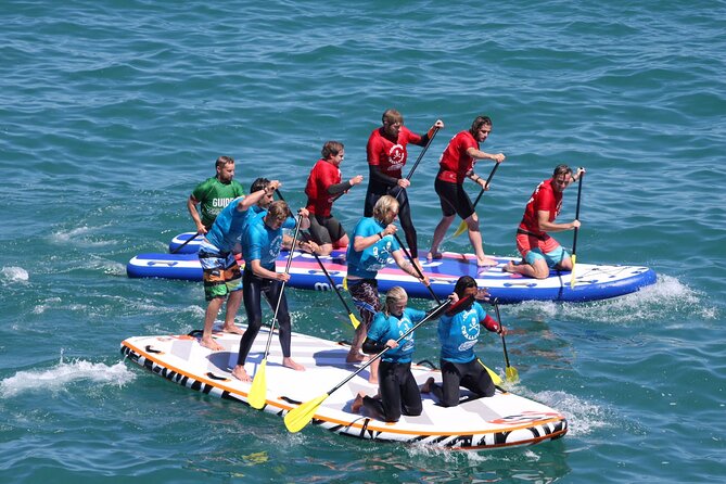 Giant Stand Up Paddle Boarding Experience in Newquay - The 2-hour super SUP run: from launch to coves and cave areas