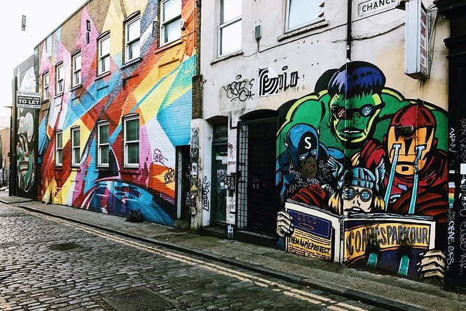 London Street Art Tour of the East End Semi-Private 12ppl Max - Stop 6: Brick Lane, street art wall-to-wall plus curry-house reputation