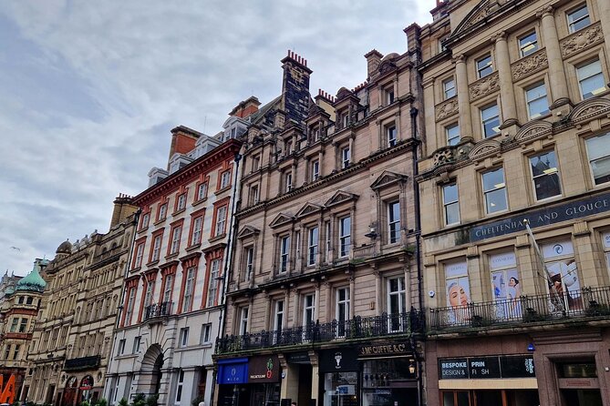 Qualified Guide: Liverpool Waterfront, City Centre & Beatles Tour - Beatles Statue and the Waterfront backdrop that frames the music