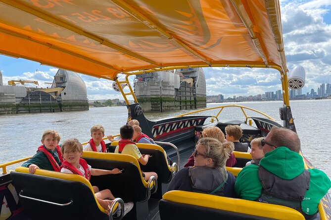 Speedboat 'THE THAMES BEAST' from Tower Millennium Pier - 40 mins - HMS Belfast to Canary Wharf: the Thames shifts from old power to new money
