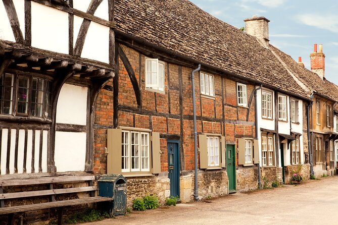 Stonehenge & the Cotswolds Including Admission from Bath - Avebury’s giant prehistoric circle in a lived-in village